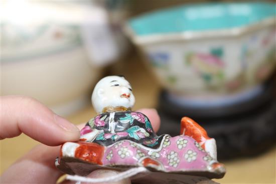 Two Chinese famille rose dishes, a figure of a boy, a porcelain brush pot and a bamboo brush pot tallest 28cm